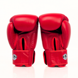 Rear view of a pair of red Windy BGVH leather Muay Thai boxing gloves showing padded backs, wrist closures and Windy branding on a white background