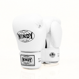 Angled view of white Windy BGVH leather Muay Thai boxing gloves showing padded knuckles, black logo details and hook-and-loop wrist closures on a white background