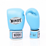 Angled view of light blue Windy BGVH Muay Thai boxing gloves showing padded knuckles, thumb guard, leather construction and secure wrist closure on a white background