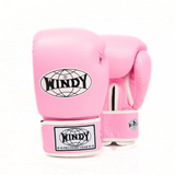 Front view of light pink Windy BGVH Muay Thai boxing gloves showing padded knuckles, thumb protection, wrist cuffs and Windy branding on a white background