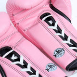 Close-up of pink Windy BGL lace-up boxing gloves showing white laces, black trim, stitched leather and Windy logos on a white background