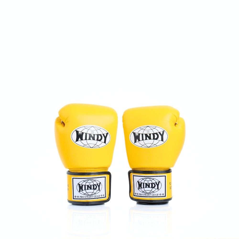 Rear view of a pair of yellow Windy BGVH leather Muay Thai boxing gloves showing the wrist closures, palm-side panels and black trim on a white background