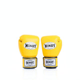 Rear view of a pair of yellow Windy BGVH leather Muay Thai boxing gloves showing the wrist closures, palm-side panels and black trim on a white background