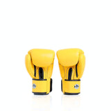 Angled view of yellow Windy BGVH leather Muay Thai boxing gloves showing the padded glove profile, wrist closures and Windy branding on a white background