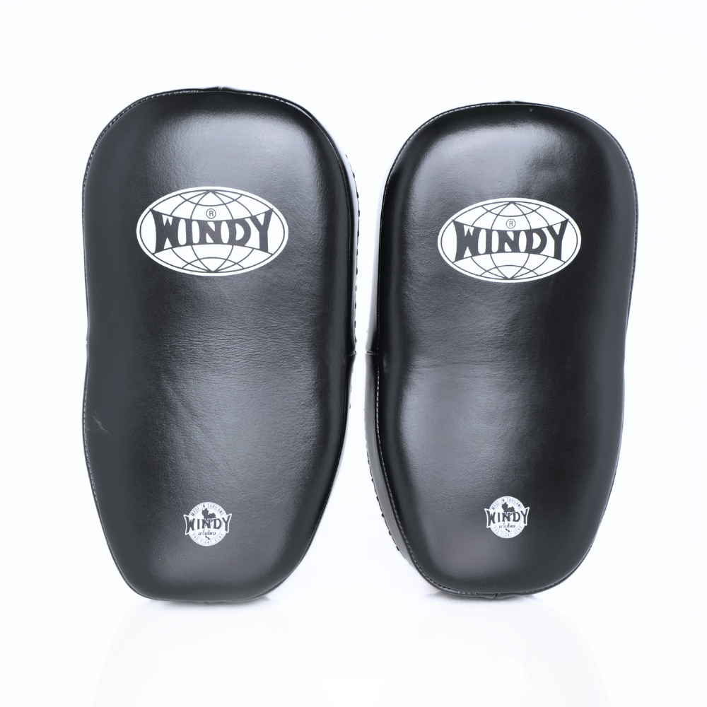 Front view of black Windy KP-8 leather kick pads showing single straps, curved impact surfaces and Windy logos on a white background