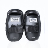Front view of a pair of black Windy KP-8 leather kick pads with padded striking surfaces, single fastening straps, Windy logos and reinforced stitching for Muay Thai and kickboxing training on a white background