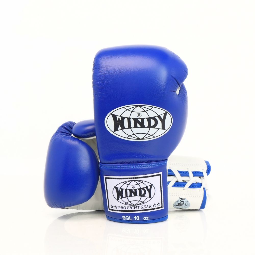 Side view of blue and white Windy BGL lace-up boxing gloves showing the padded glove profile, lace-up wrist construction and black trim on a white background