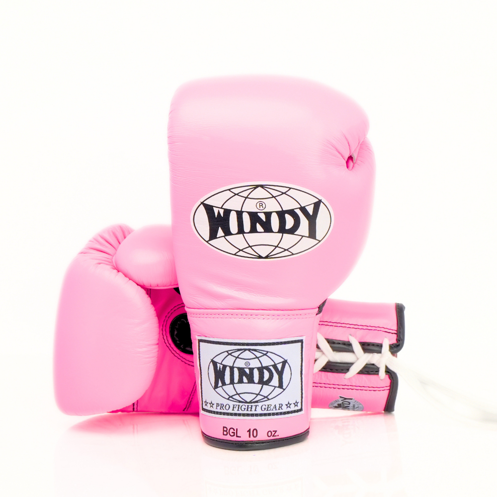 Close-up view of pink Windy BGL lace-up boxing gloves showing white laces, black edging, stitched leather and Windy branding on a white background