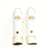 Windy LP3 white and gold Muay Thai shin guards with full-length leg and instep protection, padded shin support and Windy branding on a white background