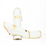 Windy LP3 white and gold Muay Thai shin guards with full-length leg and instep protection, padded shin support and Windy branding on a white background