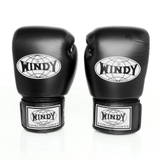 Side-by-side front and angled views of black Windy BGVH leather Muay Thai boxing gloves showing white Windy branding, padded knuckles and hook-and-loop wrist straps on a white background