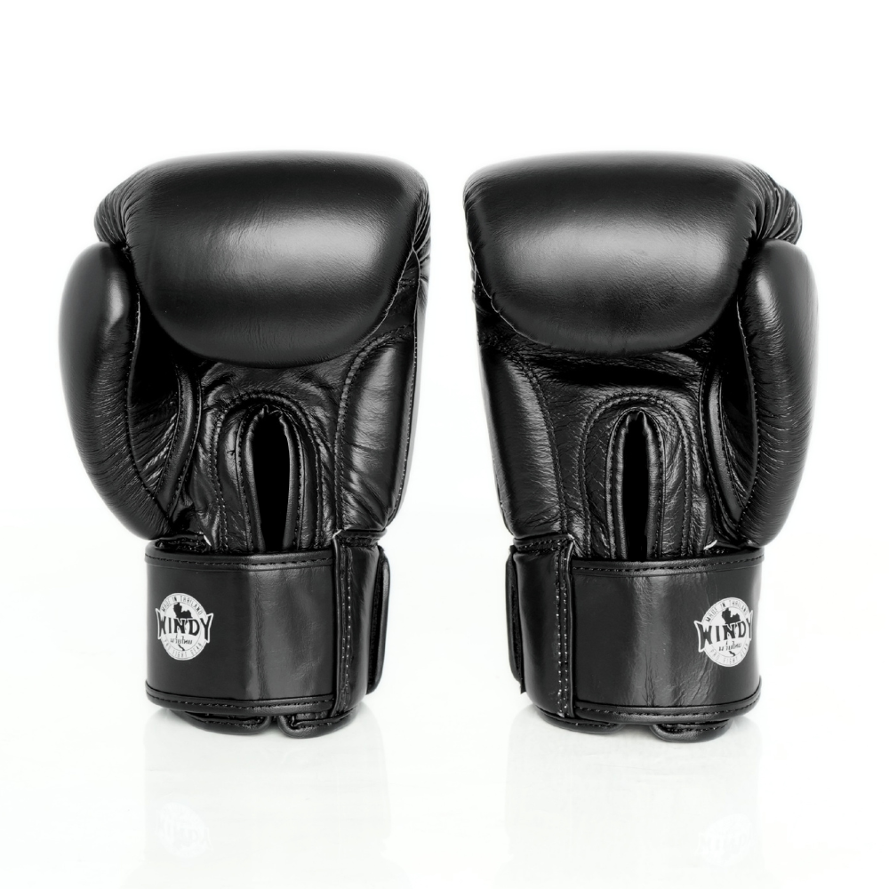 Rear view of a pair of black Windy BGVH leather Muay Thai boxing gloves showing circular white Windy logos on the wrist straps, padded backs and stitched leather details on a white background