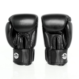 Rear view of a pair of black Windy BGVH leather Muay Thai boxing gloves showing circular white Windy logos on the wrist straps, padded backs and stitched leather details on a white background