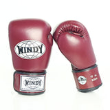 Angled view of maroon Windy BGVH Muay Thai boxing gloves showing padded knuckles, thumb guard, leather construction and secure wrist closure on a white background