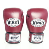 Side view of maroon Windy BGVH Muay Thai boxing gloves showing the padded glove profile, thumb guard and extended wrist cuff on a white background
