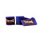 Blue Twins Special boxing hand wraps with embroidered Twins logo patches displayed on a white background