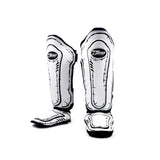 Front view of Twins Special FSGL10-66 COMIC leather shin guards showing full shin and instep coverage, protective foam padding and hook-and-loop closures on a white background