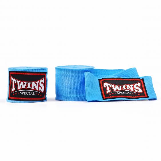 Blue Twins Special boxing hand wraps with embroidered Twins logo patches displayed on a white background