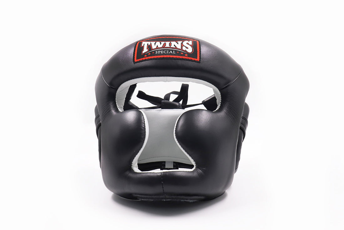 Twins Special HGL3 sparring headgear with high-density foam cheek and chin protection, lace-up top and hook-and-loop back closure for boxing, Muay Thai and kickboxing on a white background