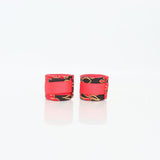 Pair of ThaiSmai Flame Muay Thai hand wraps with red, black and yellow flame print, 5-meter cotton wraps shown on a white background