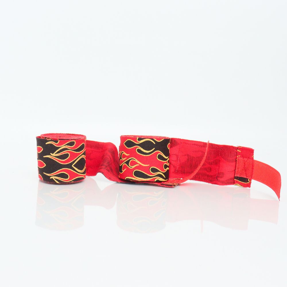ThaiSmai Flame Muay Thai hand wraps with red, black and yellow flame print, 5-meter cotton wrap roll displayed on a white background