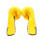 ThaiSmai BG121 lace-up boxing gloves in bright yellow leather with classic lace closure, reinforced multi-layer padding and secure wrist support for boxing and Muay Thai training on a white background
