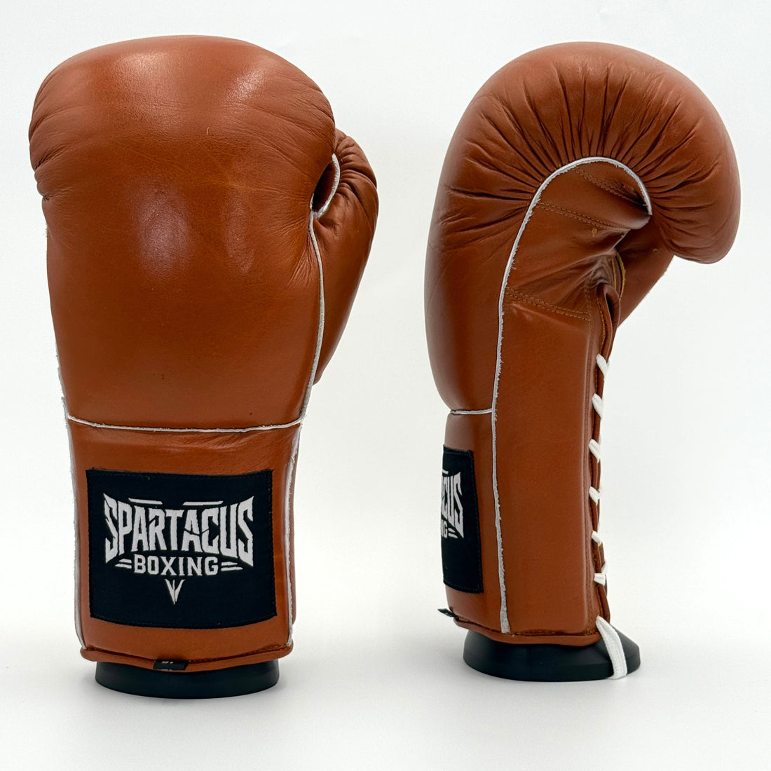 Vintage brown Spartacus Boxing old school training gloves with white piping and wrist logo.
